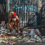 CARACAS, VENEZUELA - MARCH 5, 2019: Local residents looking for food in a pile of trash. Valery Sharifulin/TASS (Photo by Valery SharifulinTASS via Getty Images)
