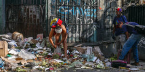 CARACAS, VENEZUELA - MARCH 5, 2019: Local residents looking for food in a pile of trash. Valery Sharifulin/TASS (Photo by Valery SharifulinTASS via Getty Images)